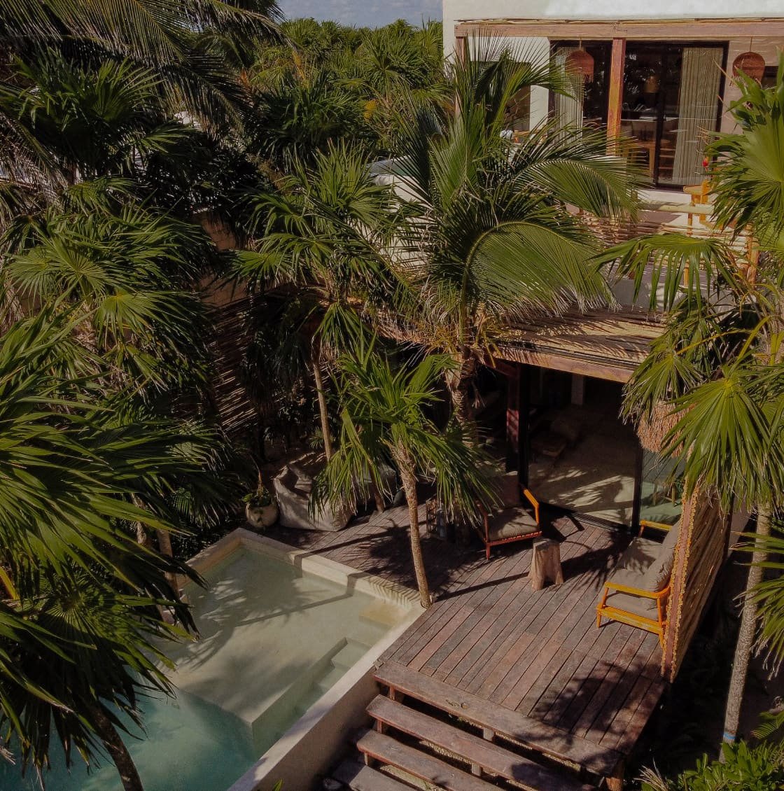 View of the large and beautiful garden of the villa Casa Chechen in Tulum, Mexico.